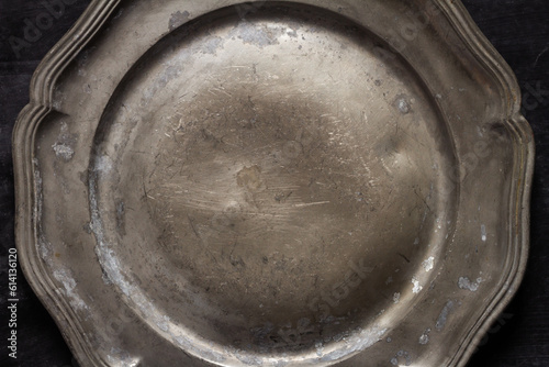 Close up of vintage pewter plate