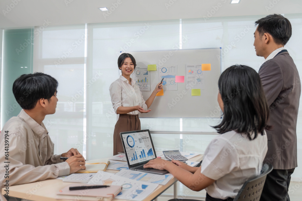 Fototapeta premium Group of creative asian business meeting and discussing strategy startup project analysis finance .Success asian business people work plan and brainstorm marketing idea with laptop in office.Teamwork