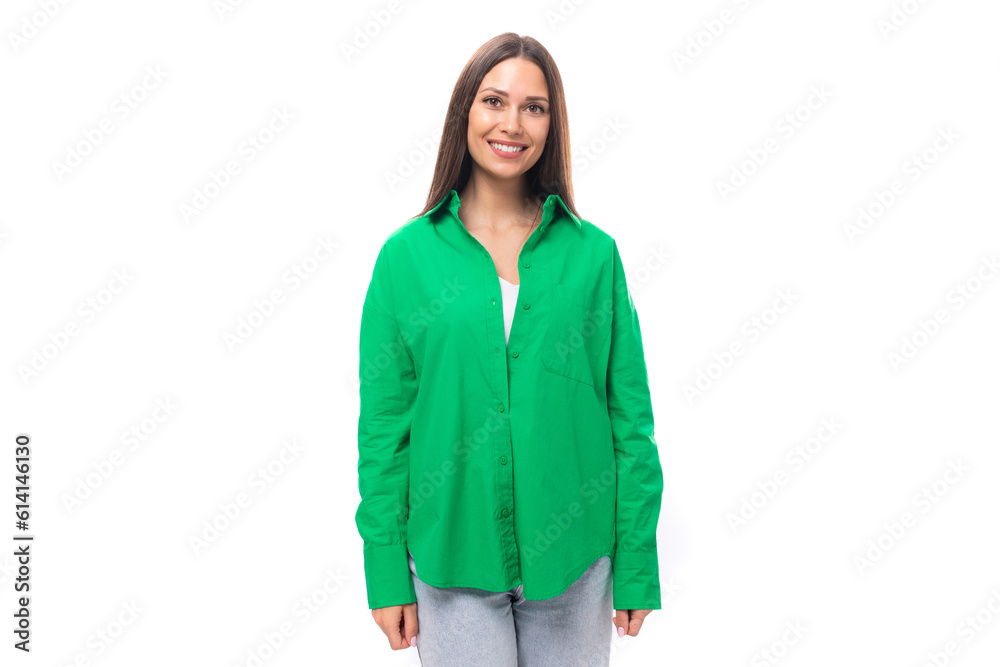 attractive young caucasian brunette lady with makeup dressed in an elegant green shirt on a white background with copy space attractive young caucasian brunette lady with makeup dressed in an elegant green shirt on a white background with copy space