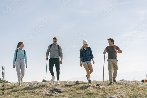 Two couples hiking in the mountains