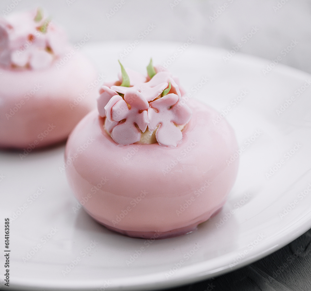 Pink mousse cakes decorated on white plate Pink mousse cakes decorated on white plate