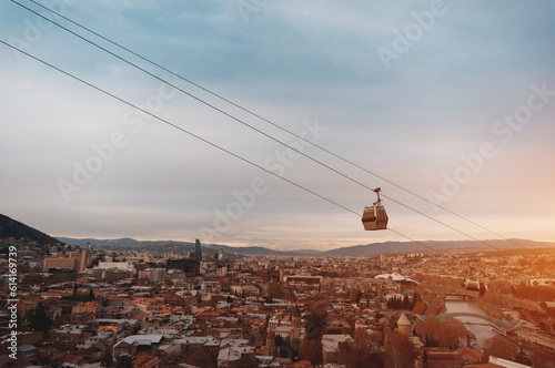 cable car rope way over Georgian capital Tbilisi, aerial of historical district photo