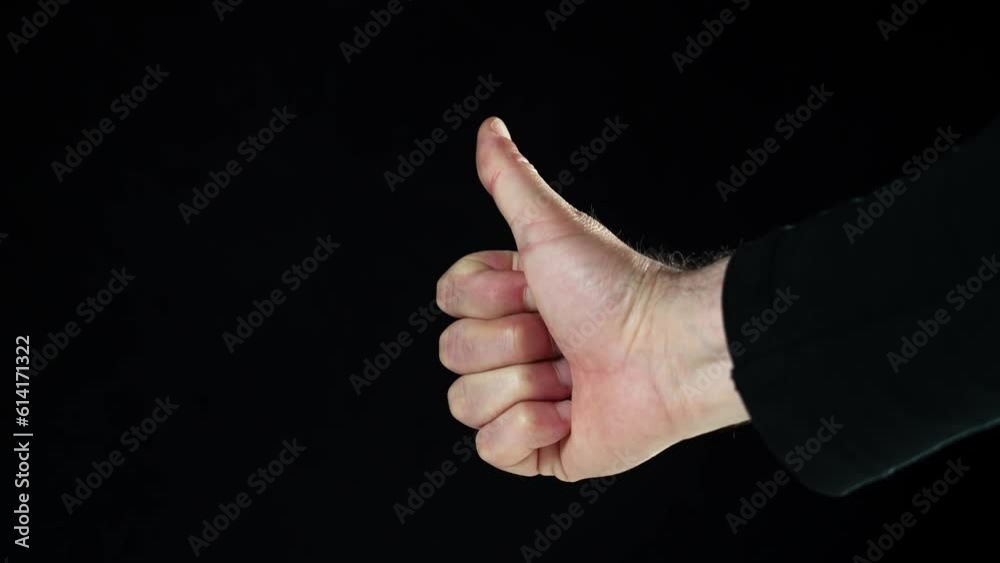 Male hand do thumbs up . Like. Keyed black background Male hand do thumbs up . Like. Keyed black background
