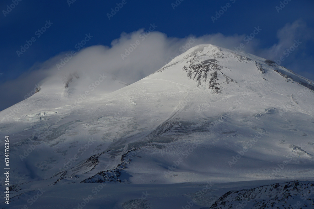 Evening Mount Elbrus with a blanket of clouds