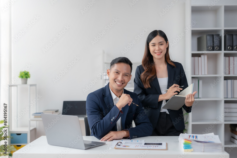 Two Young Asian business people discuss with new startup project Idea presentation, analyze planning and financial statistics and investment market at office. Two Young Asian business people discuss with new startup project Idea presentation, analyze planning and financial statistics and investment market at office.
