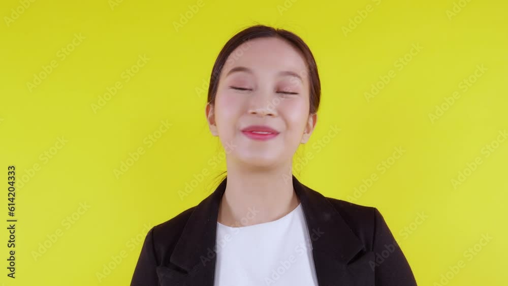 Portrait happy young asian business woman presenting isolated on yellow background, advertising and marketing, executive and manager, businesswoman confident showing and talking with expression. Portrait happy young asian business woman presenting isolated on yellow background, advertising and marketing, executive and manager, businesswoman confident showing and talking with expression.