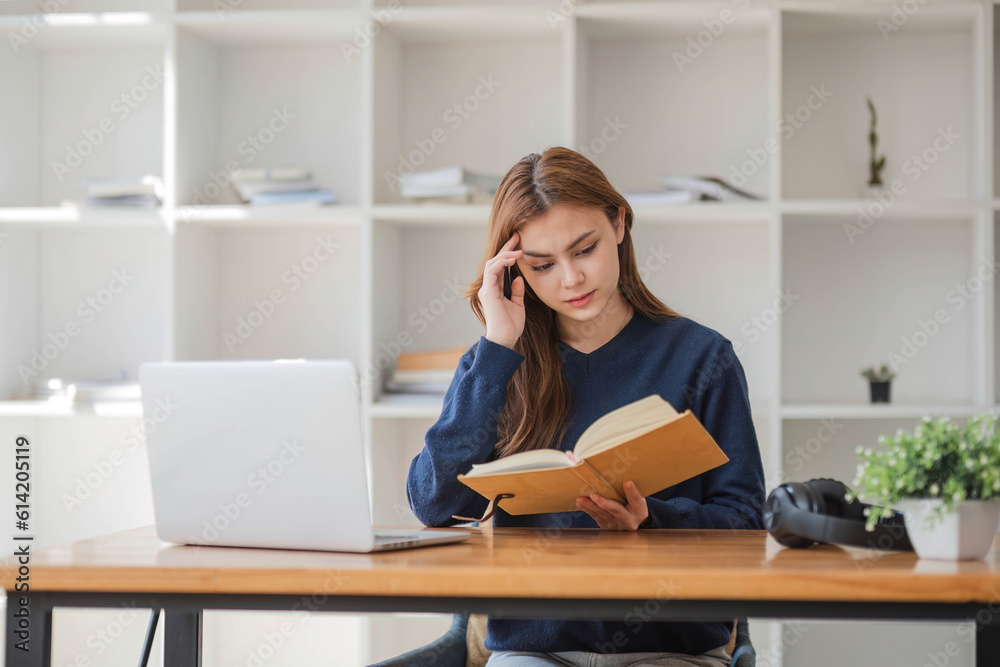 Asian women are bored from their online studies, have a sad face and have been tired from their studies for a long time. Asian women are bored from their online studies, have a sad face and have been tired from their studies for a long time.