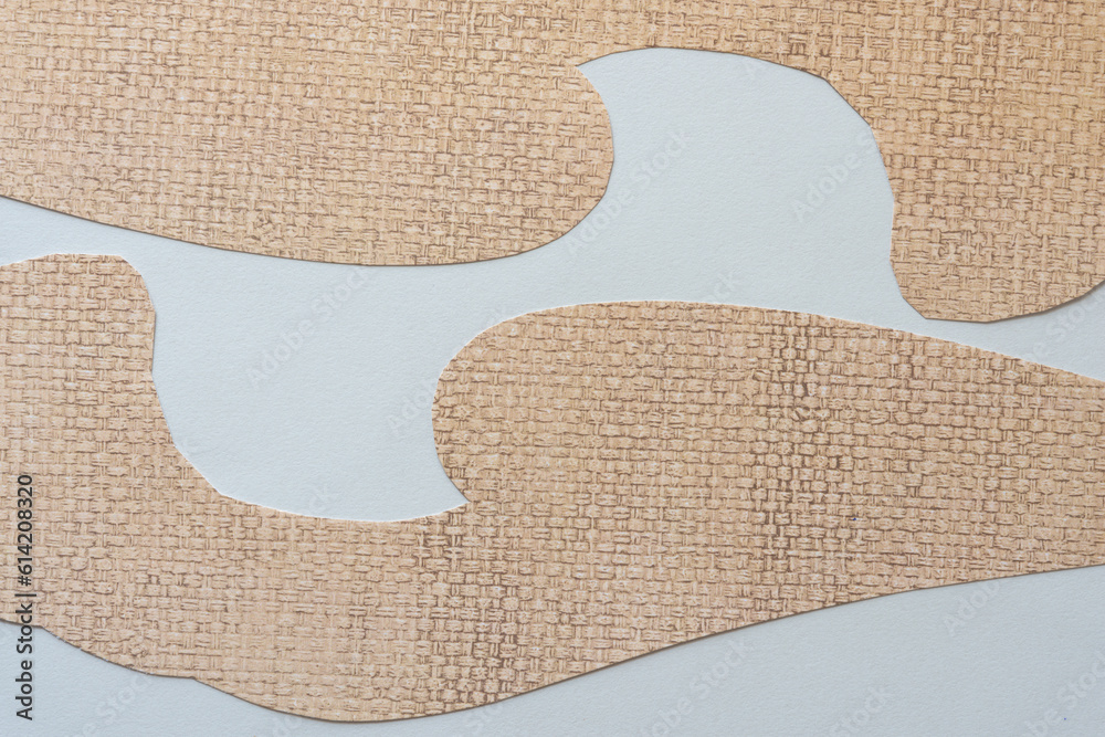 two shapes made of scrapbook paper with weave pattern on blank paper two shapes made of scrapbook paper with weave pattern on blank paper