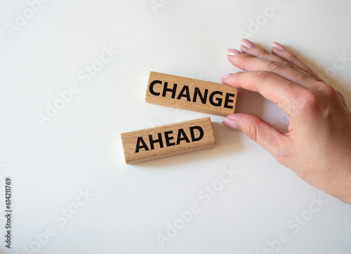 Change ahead symbol. Wooden blocks with words Change ahead. Businessman hand. Beautiful white background. Business and Change ahead concept. Copy space.