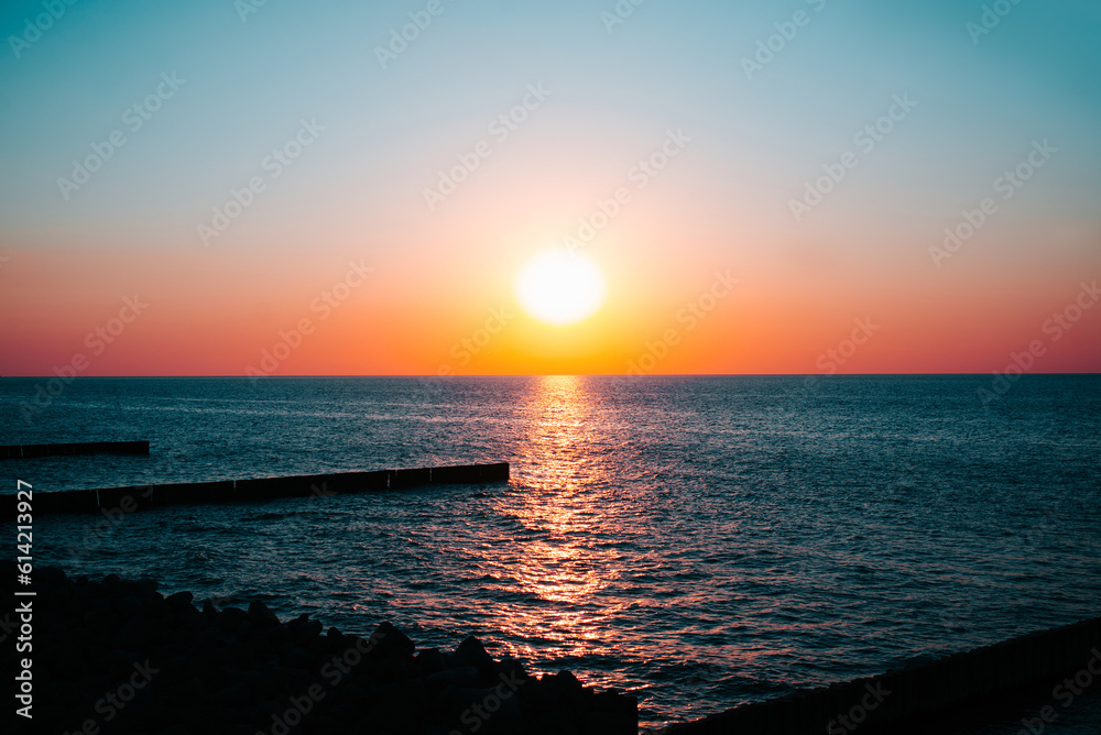 Sunset on the sea, sun and water seascape on a summer evening Sunset on the sea, sun and water seascape on a summer evening
