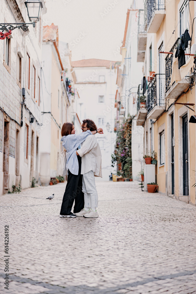 Romantic Tourist couple in love cuddling on old Lisbon street. Travel And tourism In Europe concept