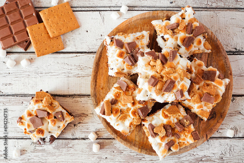 Smores brownies dessert platter. Top down view table scene on a white wood background. photo