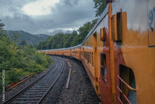 View from Indian train to unique and amazed nature scenic landscape of rain forest near Dudhsagar Falls. Goa, India. Tourism beautiful destination place.  Discover India. Open world after covid-19 photo
