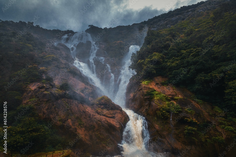 Unique and amazed nature scenic landscape of Dudhsagar Falls in rain forest. Sonaulim, Goa, India. Tourism beautiful destination place. Discover the beauty of earth. Open world after covid-19