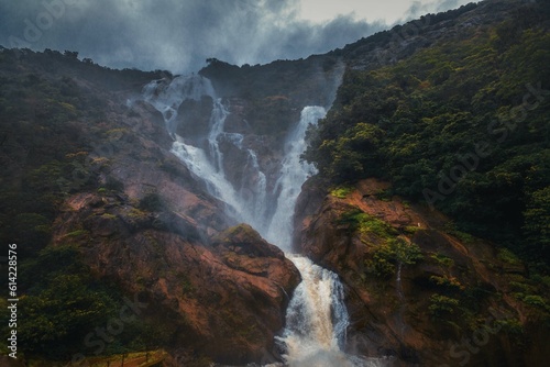 Obraz na płótnie Unique and amazed nature scenic landscape of Dudhsagar Falls in rain forest. Sonaulim, Goa, India. Tourism beautiful destination place. Discover the beauty of earth. Open world after covid-19 w salonie