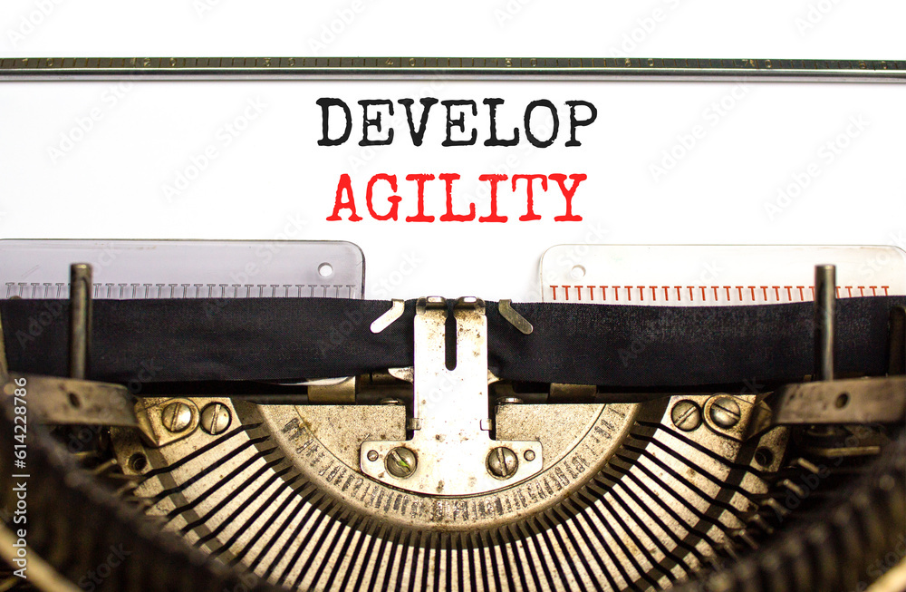 Develop agility symbol. Concept words Develop agility typed on beautiful old retro typewriter. Beautiful white background. Business, support and develop agility concept. Copy space.