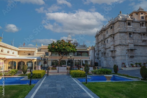 Romantic and luxury City Palace of Maharajah in Udaipur on Lake Pichola at sunset. Rajasthan, Discover the beauty of India. Open world after covid-19 photo