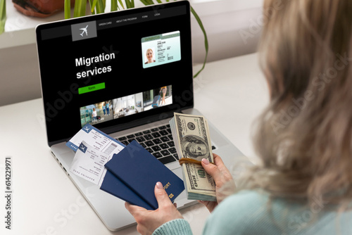 laptop with migration service, online for foreign job, education or emigration to America