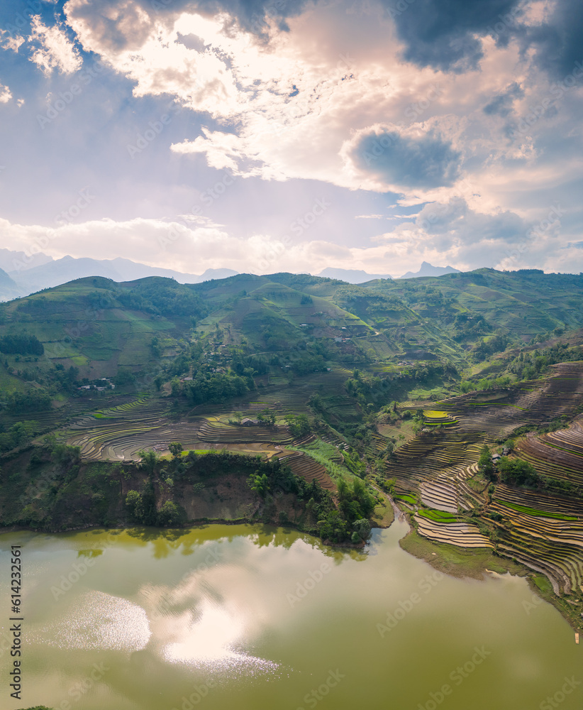 The pouring water season makes the terraced fields of Y Ty commune, Lao Cai province, Vietnam appear with brown soil blending with the beautiful sky.