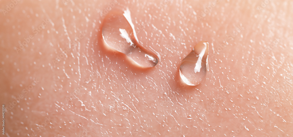 Fototapeta premium Collagen And Hyaluron Serum Gel On Skin. Splashing of Hyaluron gel. Liquid hyaluronic acid gel on skin. Cosmetic water gel texture on human skin background. Textured background. skin care product.