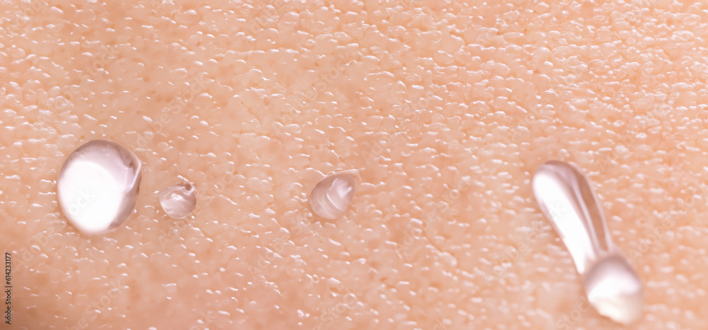 Fototapeta premium Collagen And Hyaluron Serum Gel On Skin. Splashing of Hyaluron gel. Liquid hyaluronic acid gel on skin. Cosmetic water gel texture on human skin background. Textured background. skin care product.