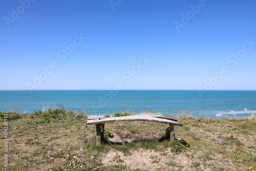 Old bench with a beautiful view of the beach and the North Sea