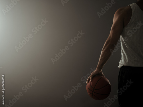 Rear view of a basketball player in the empty gym with copy space © rangizzz