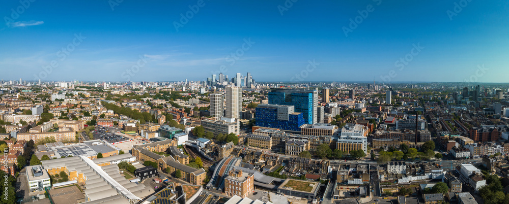 Panoramic view of the hospital building in London with the helicopter located on the roof and Canary Wharf business district on the horizon.