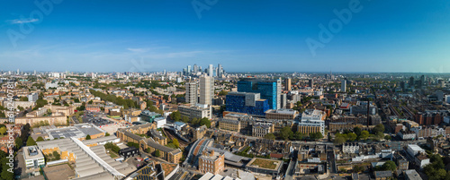 Panoramic view of the hospital building in London with the helicopter located on the roof and Canary Wharf business district on the horizon.