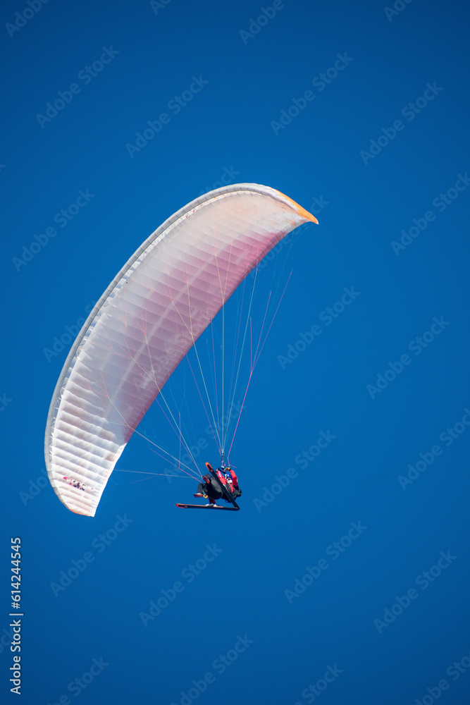 Close-up of paraglider flying over the French Alps, January 2023, Les Deux Alpes Close-up of paraglider flying over the French Alps, January 2023, Les Deux Alpes