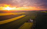Spring sunset over polish province, fields and a church aerial photo