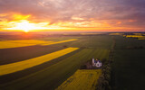 Spring sunset over polish province, fields and a church aerial photo
