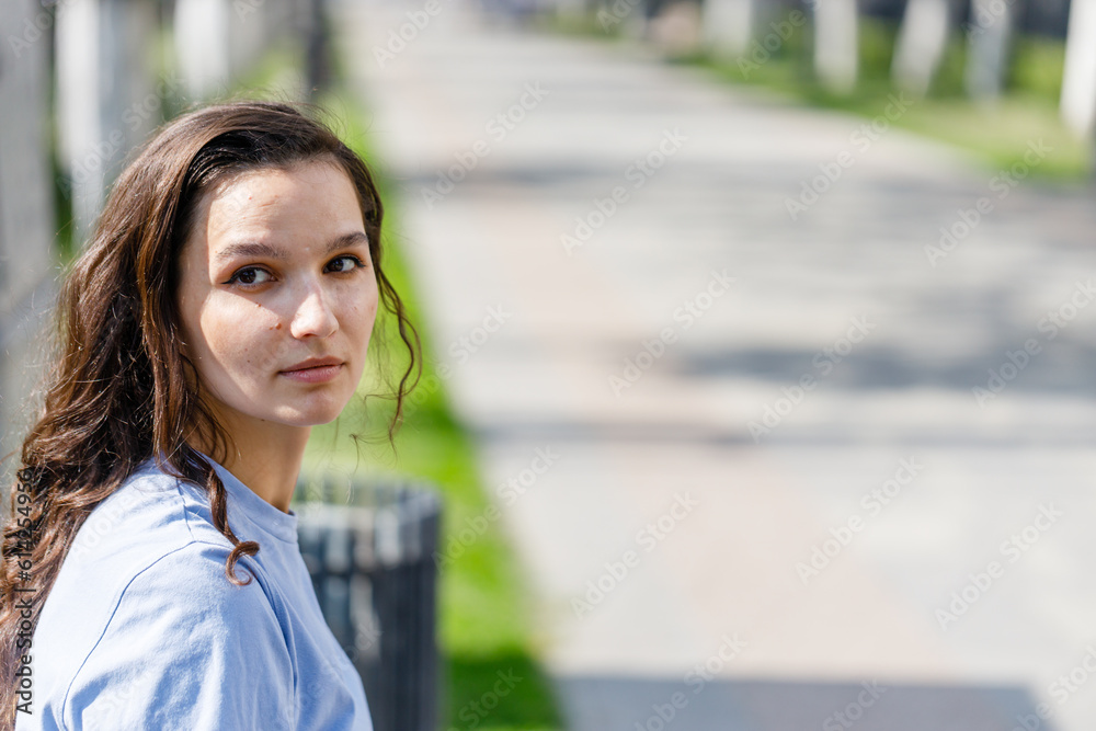 Portrait of a beautiful brunette girl outdoors on city street Portrait of a beautiful brunette girl outdoors on city street
