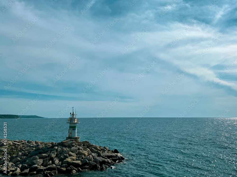 Kalekoy lighthouse view from the sea of Gokceada Imbros island kalekoy harbor. Canakkale, Turkey