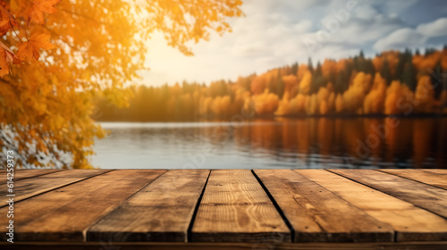 Autumn background, close up of old empty wooden table over the lake with trees and leaves with copy space.Created with Generative AI technology. photo