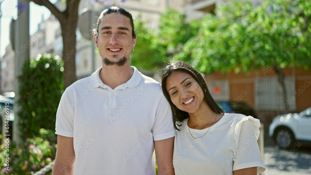 Man and woman couple smiling confident standing together at park Man and woman couple smiling confident standing together at park
