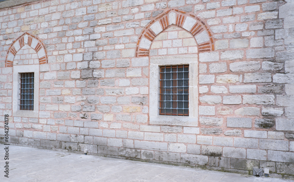 Window on a brick wall under brick arch. Window on a brick wall under brick arch.
