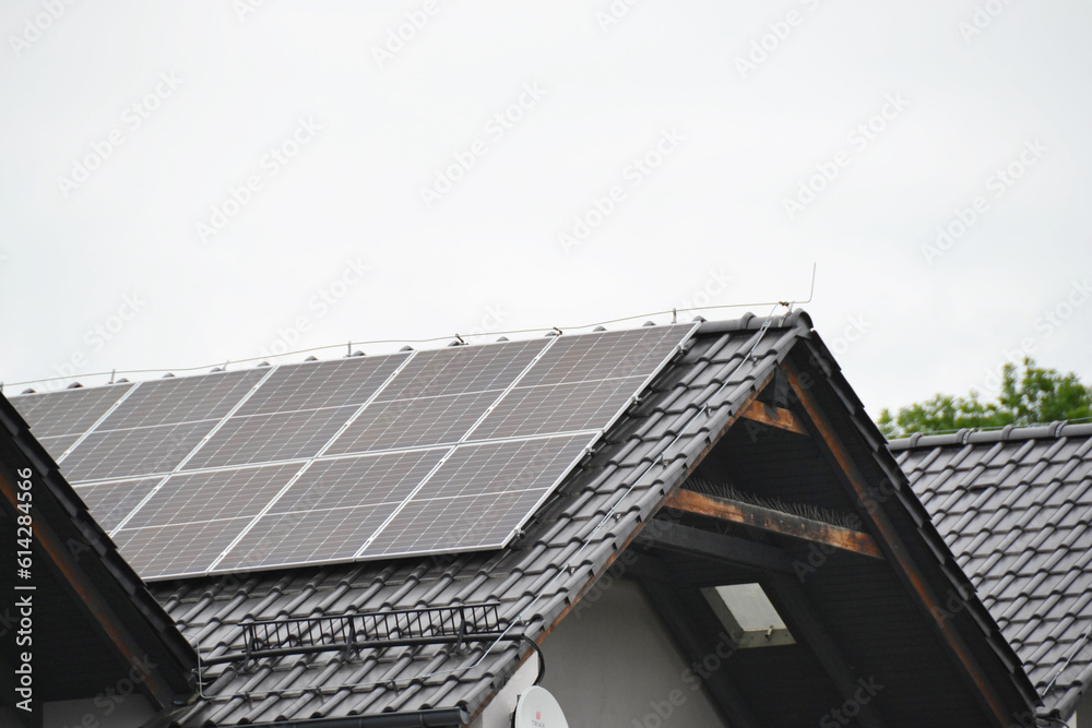 Fototapeta premium Installing a Solar Cell on a Roof.