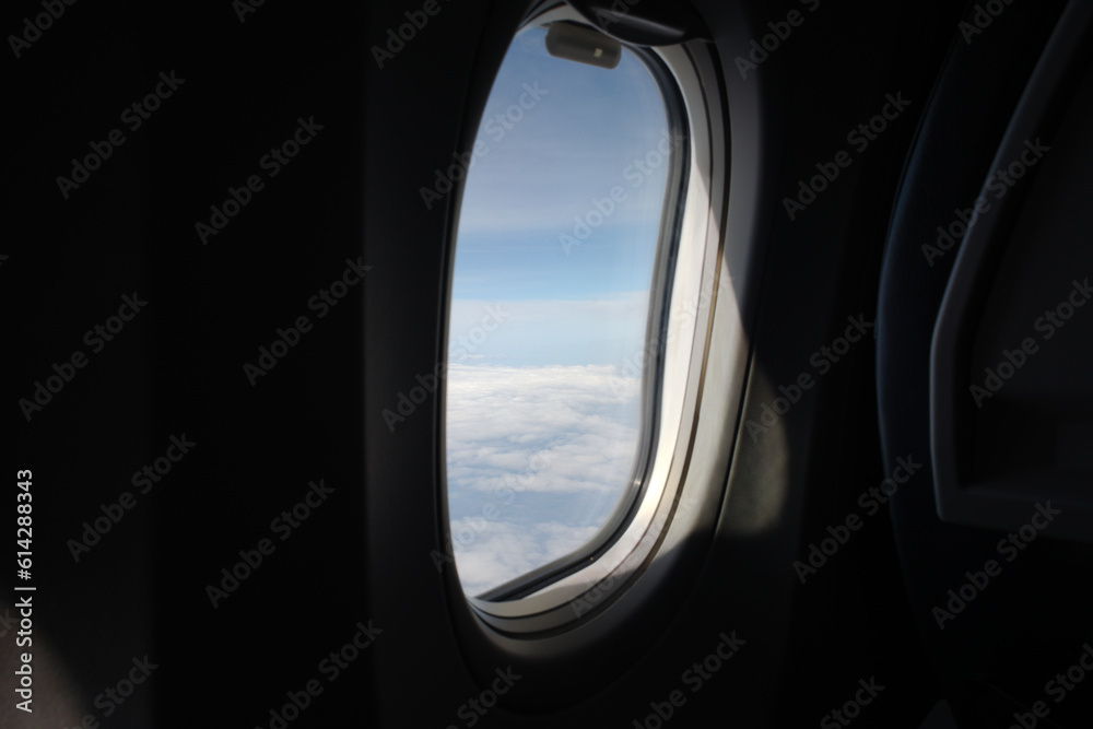 View from airplane window. Oval portal to the outside world. View from airplane window. Oval portal to the outside world.