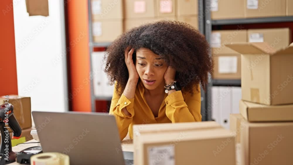 African american woman ecommerce business worker using laptop stressed at office African american woman ecommerce business worker using laptop stressed at office