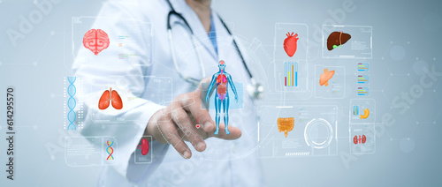 Doctor touch hologram of human system. Medical future technology and innovative concept. The concept support the health of the internal organs of the body.Modern medicine,healthcare,medical insurance