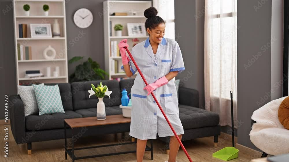 African american woman clean professional washing floor dancing at home African american woman clean professional washing floor dancing at home