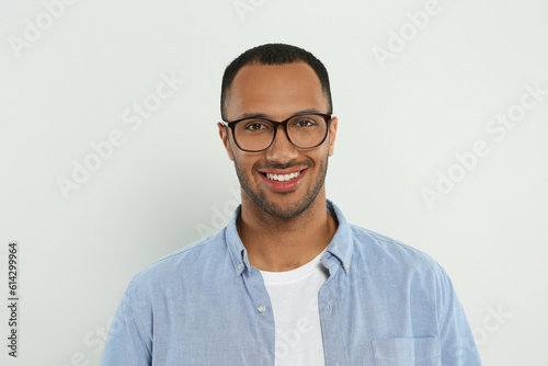 Portrait of handsome young man on white background © New Africa