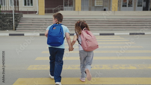 asphalt zebra crossing, school road, student happy family road, green light, run hand girl boy, parent teaches boy follow traffic rules safety, city life, lot pedestrians, dad daughter walk road © Валерий Зотьев