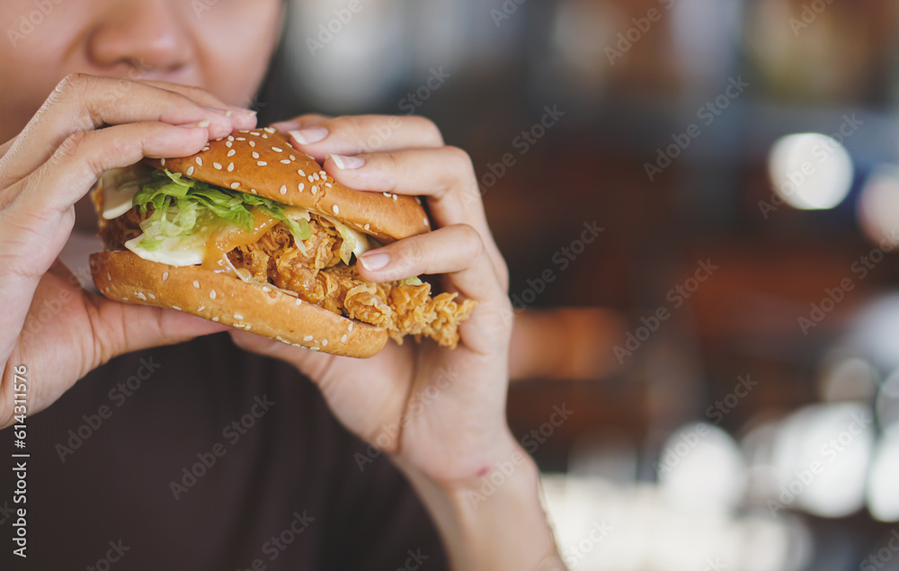 person eating burger