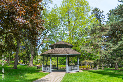 Rosetta McClain Gardens cabin shade made of wood and surrounded by gardens trees. Picturesque public garden located in Scarborough, Ontario, Canada. Scarborough Bluffs area. © ﻿ MotionPixxleStudio