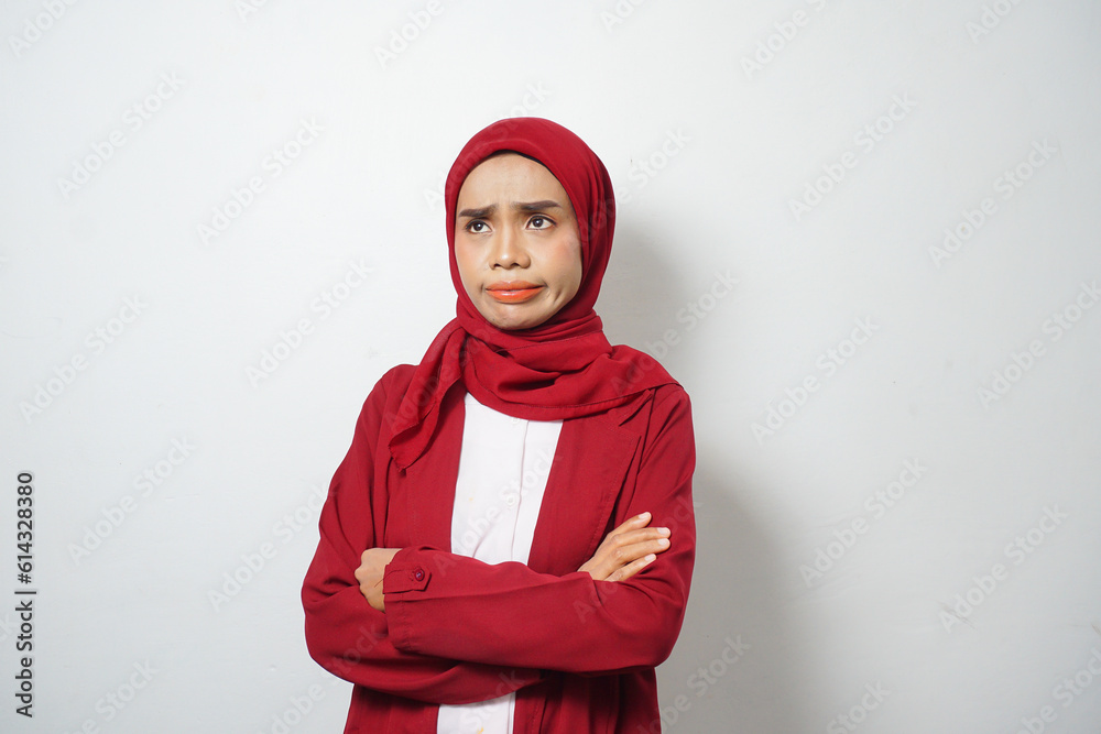 Asian business Muslim woman in red casual with disappointed face Asian business Muslim woman in red casual with disappointed face