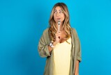 Photo of dreamy young beautiful blonde woman wearing overshirt lick fork look empty space