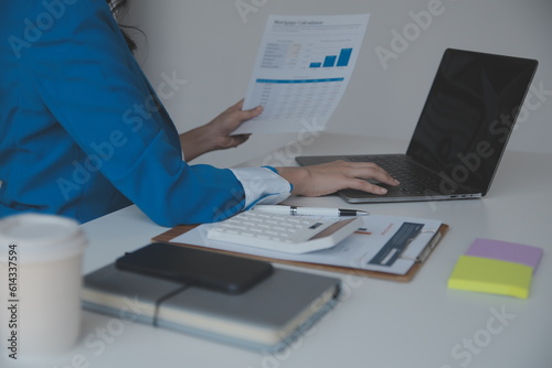 Audit concept,Administrator business man financial inspector and secretary making report calculating balance. Internal Revenue Service checking document.