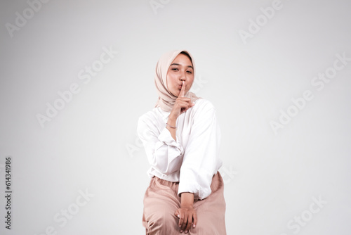 Fashion portrait of young beautiful asian muslim woman with wearing hijab isolated on white background. 